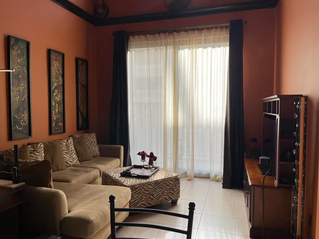 a living room with furniture and a window