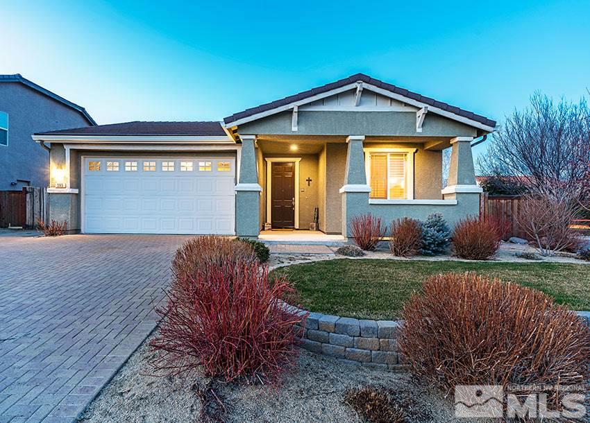 395 Sondrio Way Reno, NV 89521 - Photo 1 of 25 a front view of a house with garden