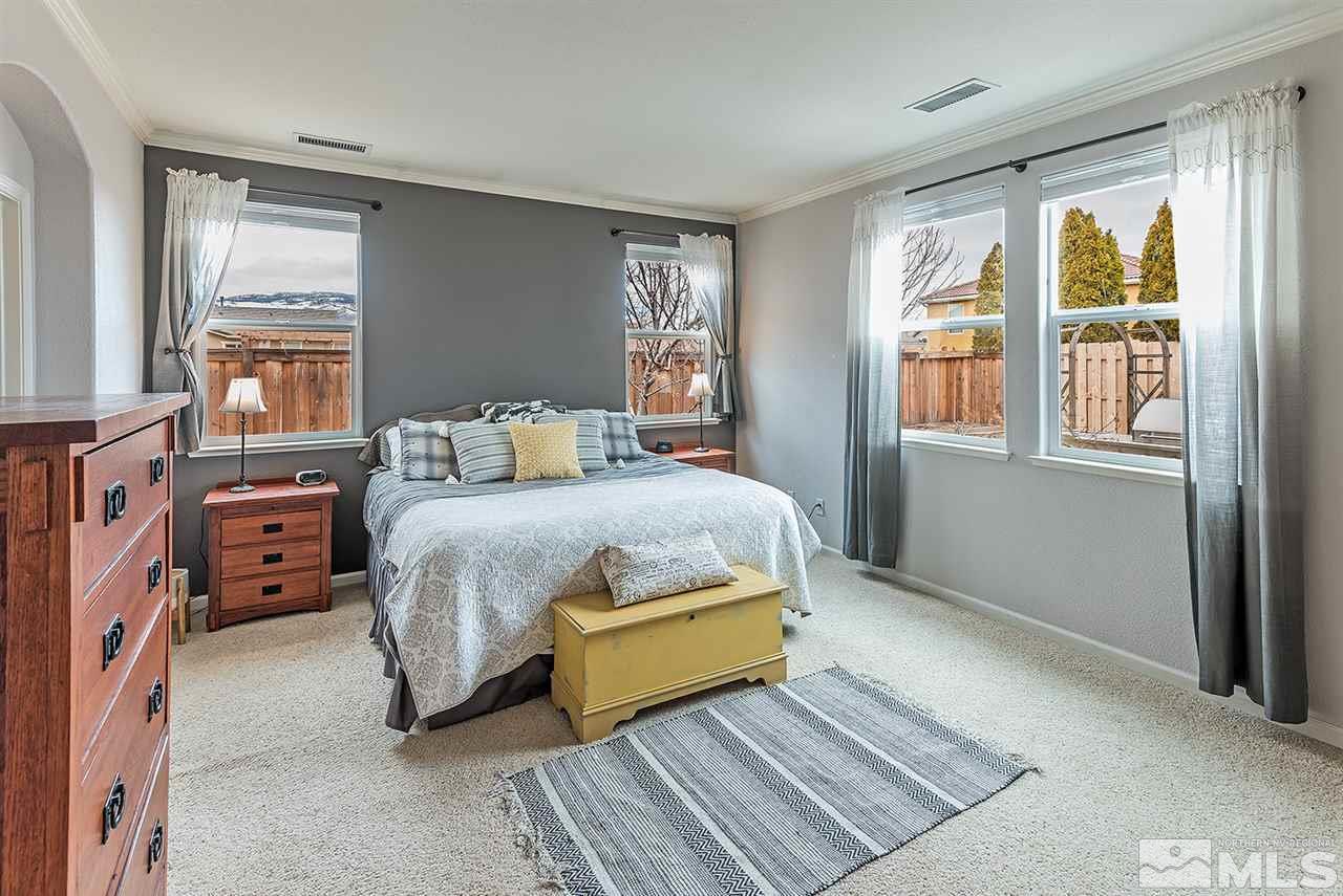 395 Sondrio Way Reno, NV 89521 - Photo 13 of 25 a bedroom with a bed and a window