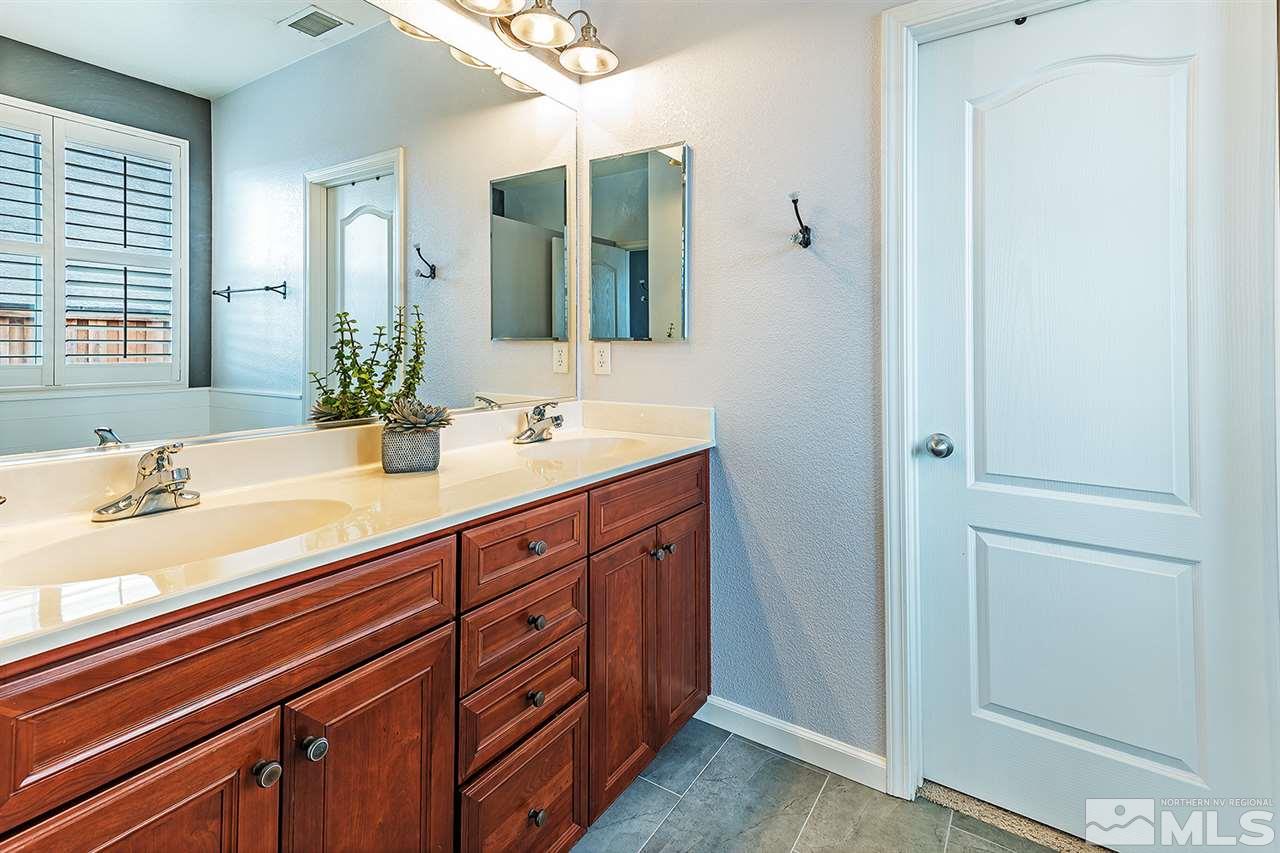 395 Sondrio Way Reno, NV 89521 - Photo 15 of 25 a bathroom with a sink and a mirror