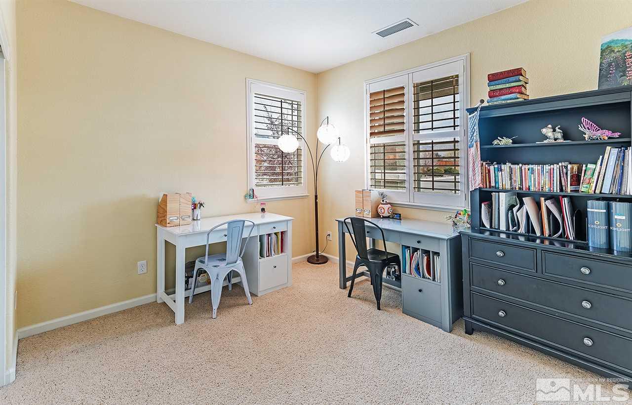 395 Sondrio Way Reno, NV 89521 - Photo 16 of 25 a view of a workspace with furniture and toys