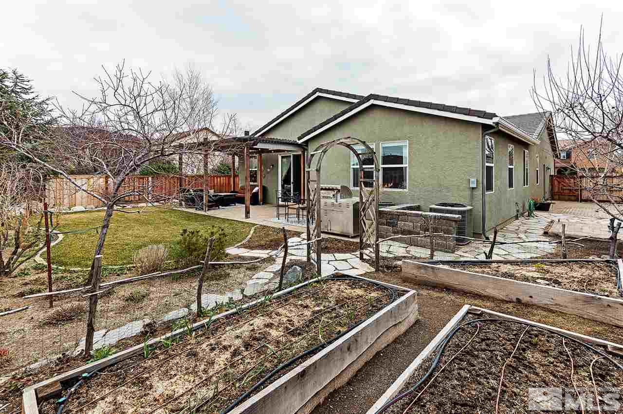 395 Sondrio Way Reno, NV 89521 - Photo 20 of 25 a front view of a house with garden