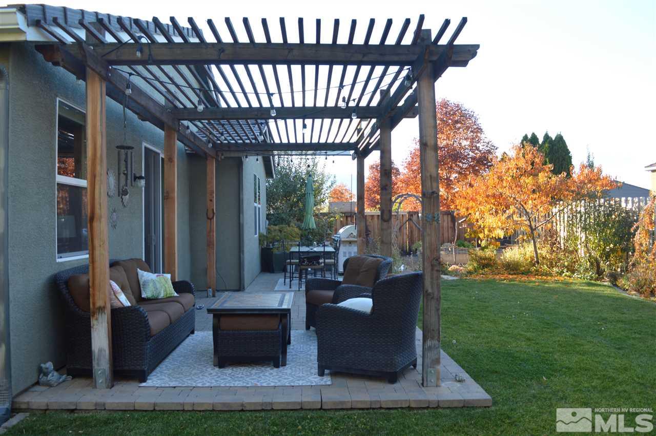 395 Sondrio Way Reno, NV 89521 - Photo 24 of 25 a patio with table and chairs