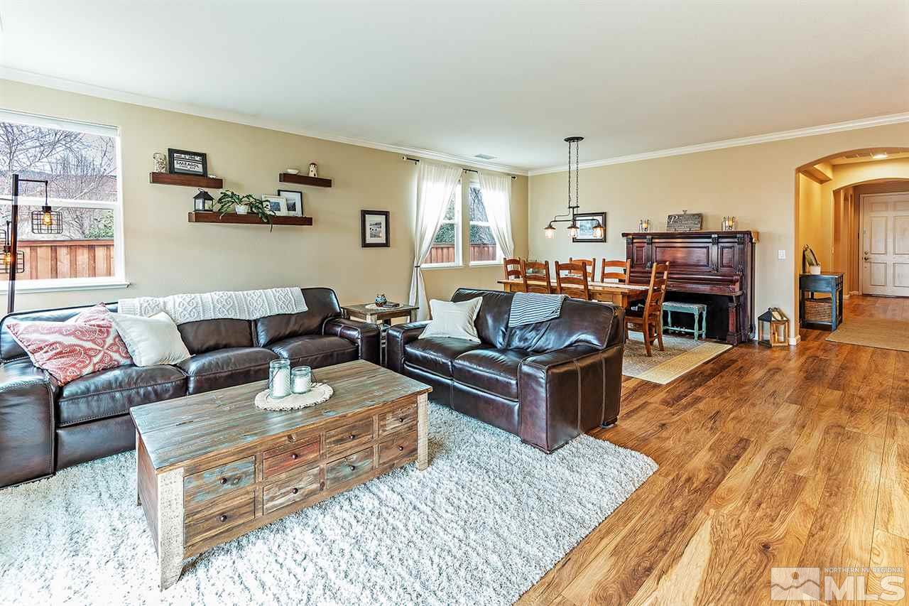 395 Sondrio Way Reno, NV 89521 - Photo 8 of 25 a living room with furniture and a wooden floor