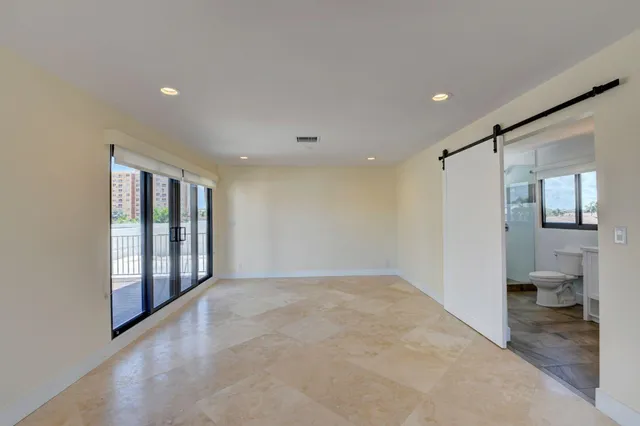 a view of a backyard with plants and a patio