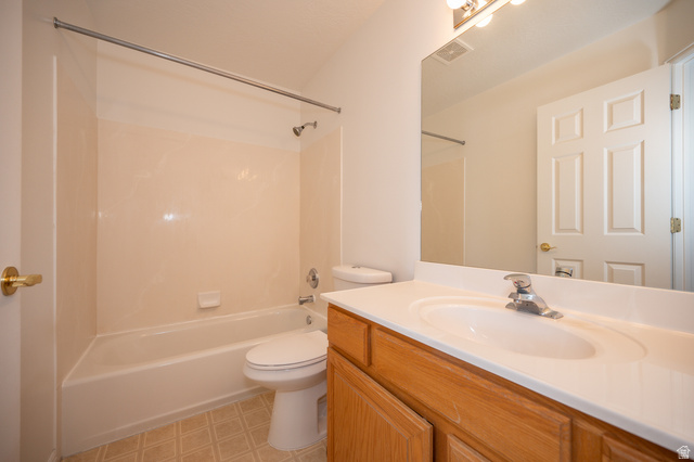 1799 West 1110th Street North Provo, UT 84604 - Photo 15 of 24 Bathroom featuring a full vanity with an integrated sink, wood-finish cabinetry, a large mirror, and overhead lighting