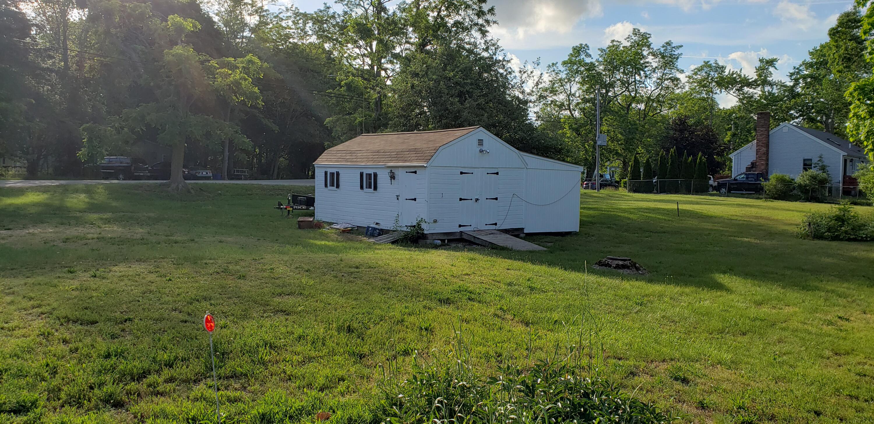 47 Gault Road West Wareham, MA 02576 - Photo 4 of 25 a view of a barn in the middle of a yard