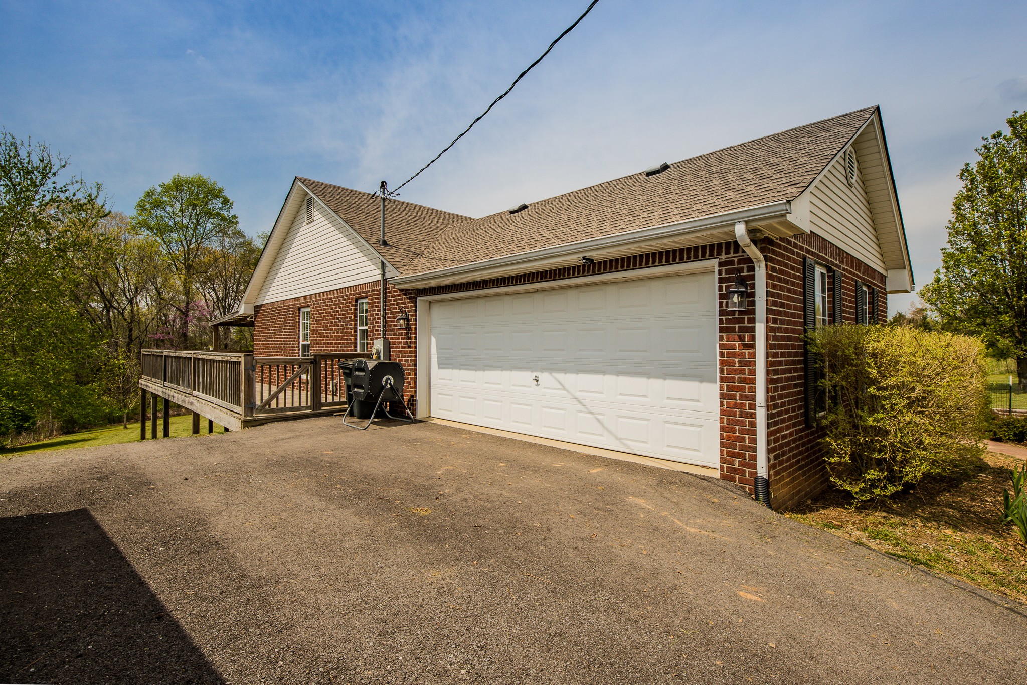 1044 Porter Road Burns, TN 37029 - Photo 32 of 34 a view of a house with backyard and garage