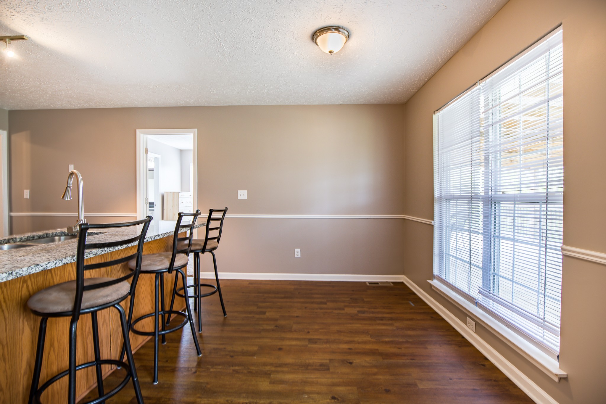 1044 Porter Road Burns, TN 37029 - Photo 8 of 34 a view of a dining room with furniture and wooden floor