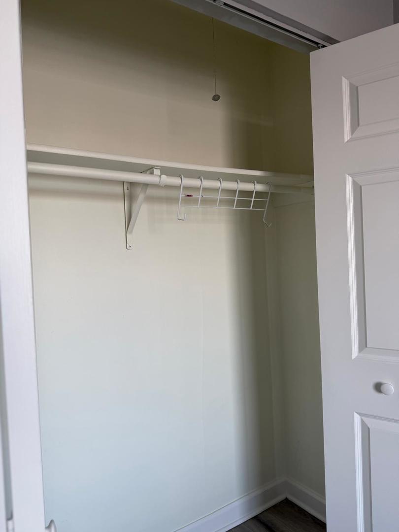 157 North Gregory Street, Unit 14 Aurora, IL 60504 - Photo 10 of 15 a view of a room with racks on the wall