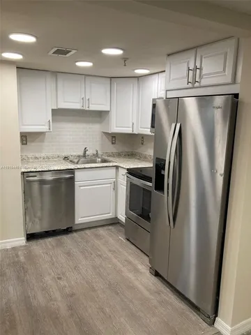 a kitchen with a stove and a microwave