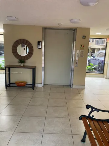 a view of kitchen with furniture and a window