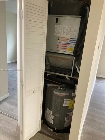 a view of a porch with furniture and a yard