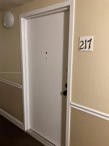 a view of a hallway with closet