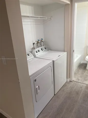 a utility room with dryer and washer