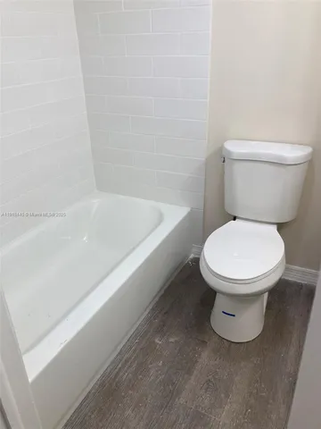 a kitchen with stainless steel appliances granite countertop a refrigerator sink and stove