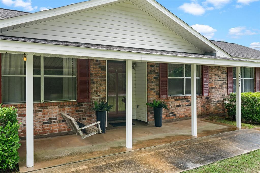 927 Stonewall-Preston Road Stonewall, LA 71078 - Photo 3 of 28 a view of a house with backyard porch and sitting area