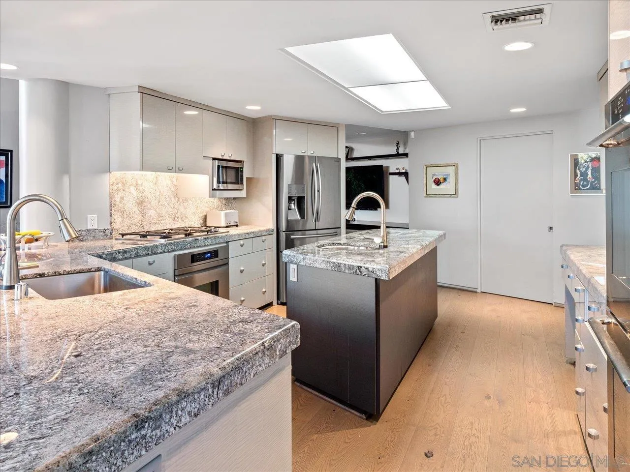 2640 Inyaha Lane La Jolla, CA 92037 - Photo 11 of 25 a large kitchen with stainless steel appliances granite countertop a sink stove and refrigerator