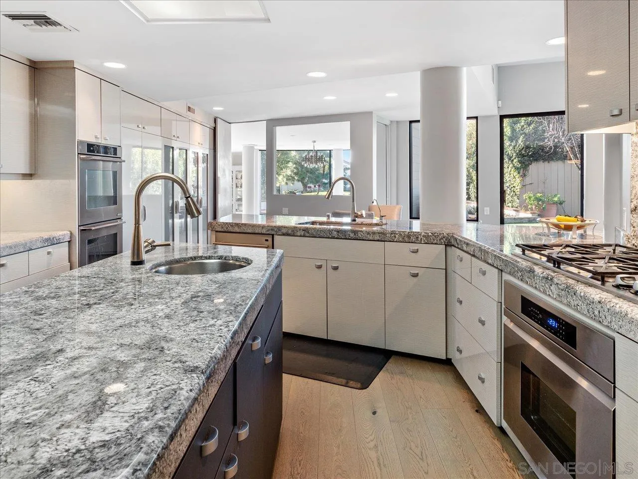 2640 Inyaha Lane La Jolla, CA 92037 - Photo 12 of 25 a kitchen with granite countertop a sink stove and cabinets