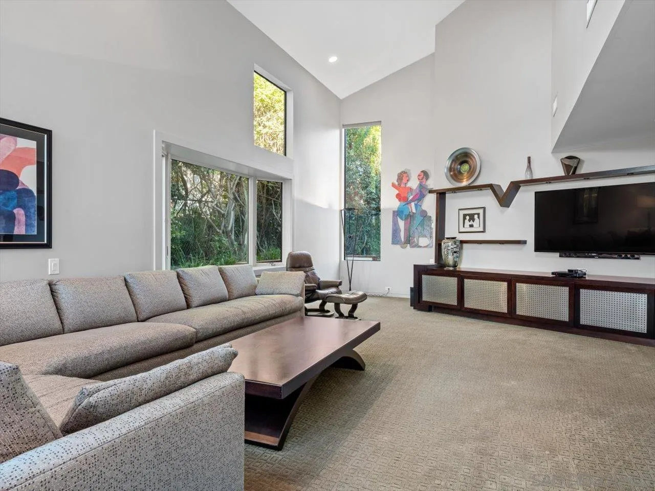 2640 Inyaha Lane La Jolla, CA 92037 - Photo 14 of 25 a living room with furniture and a flat screen tv