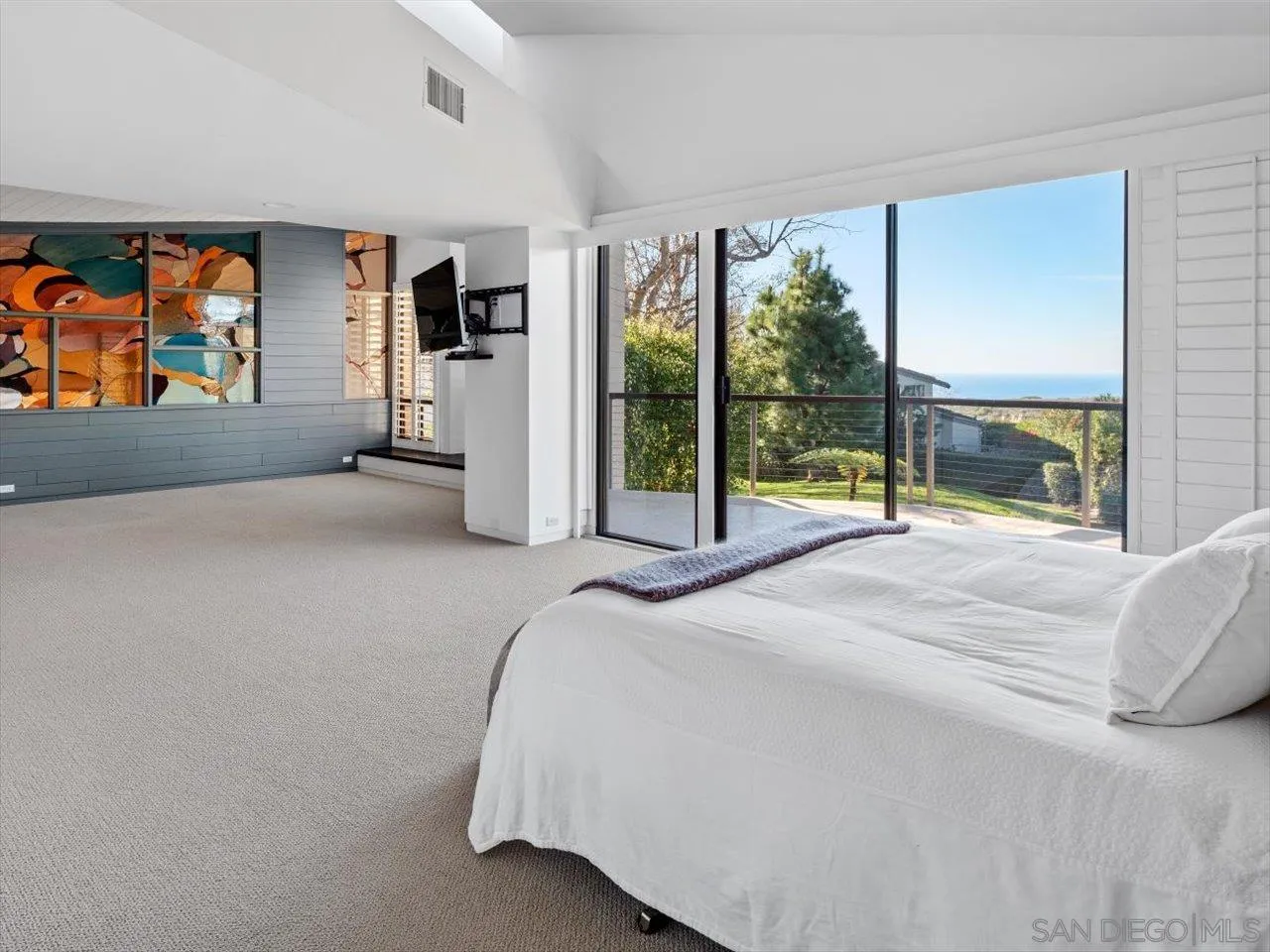 2640 Inyaha Lane La Jolla, CA 92037 - Photo 15 of 25 a bedroom with a bed and a large window