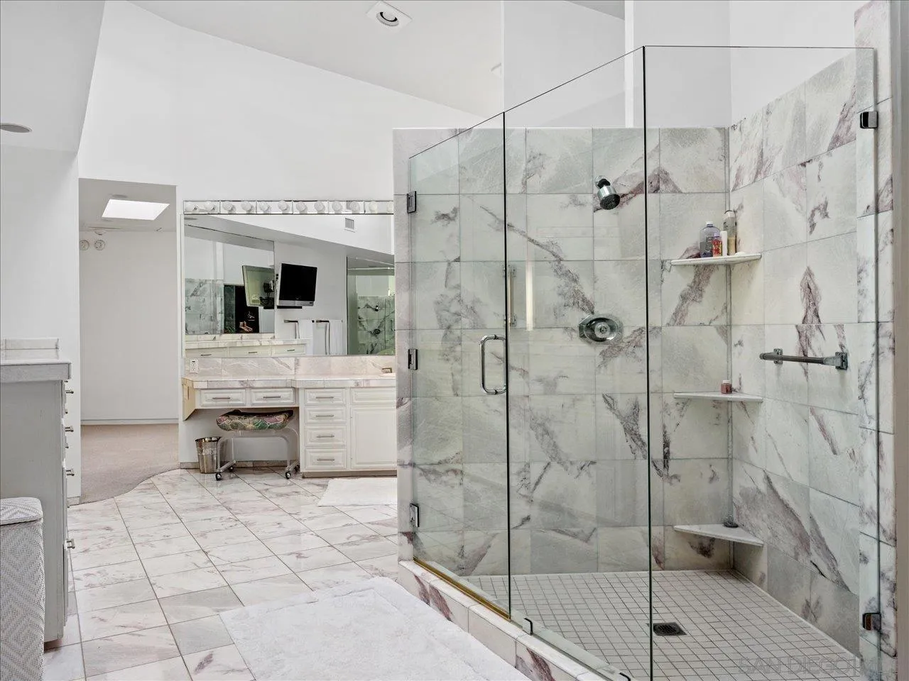 2640 Inyaha Lane La Jolla, CA 92037 - Photo 17 of 25 a bathroom with a shower sink and mirror