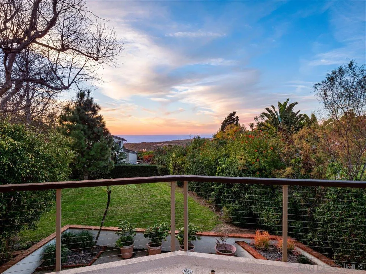 2640 Inyaha Lane La Jolla, CA 92037 - Photo 4 of 25 a view of a balcony with two chairs and a table