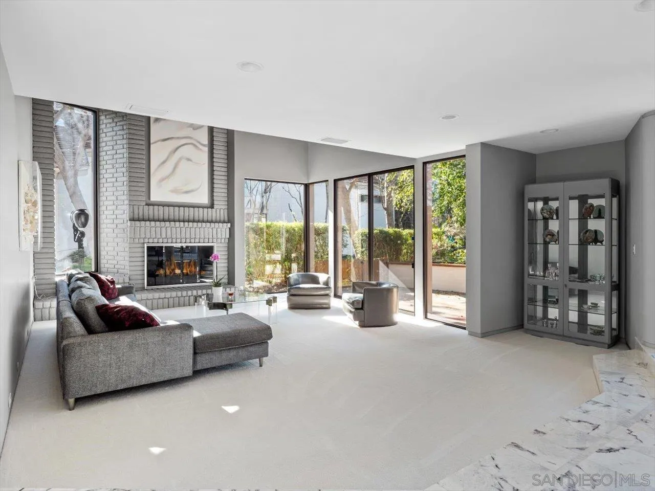 2640 Inyaha Lane La Jolla, CA 92037 - Photo 6 of 25 a living room with furniture and large windows