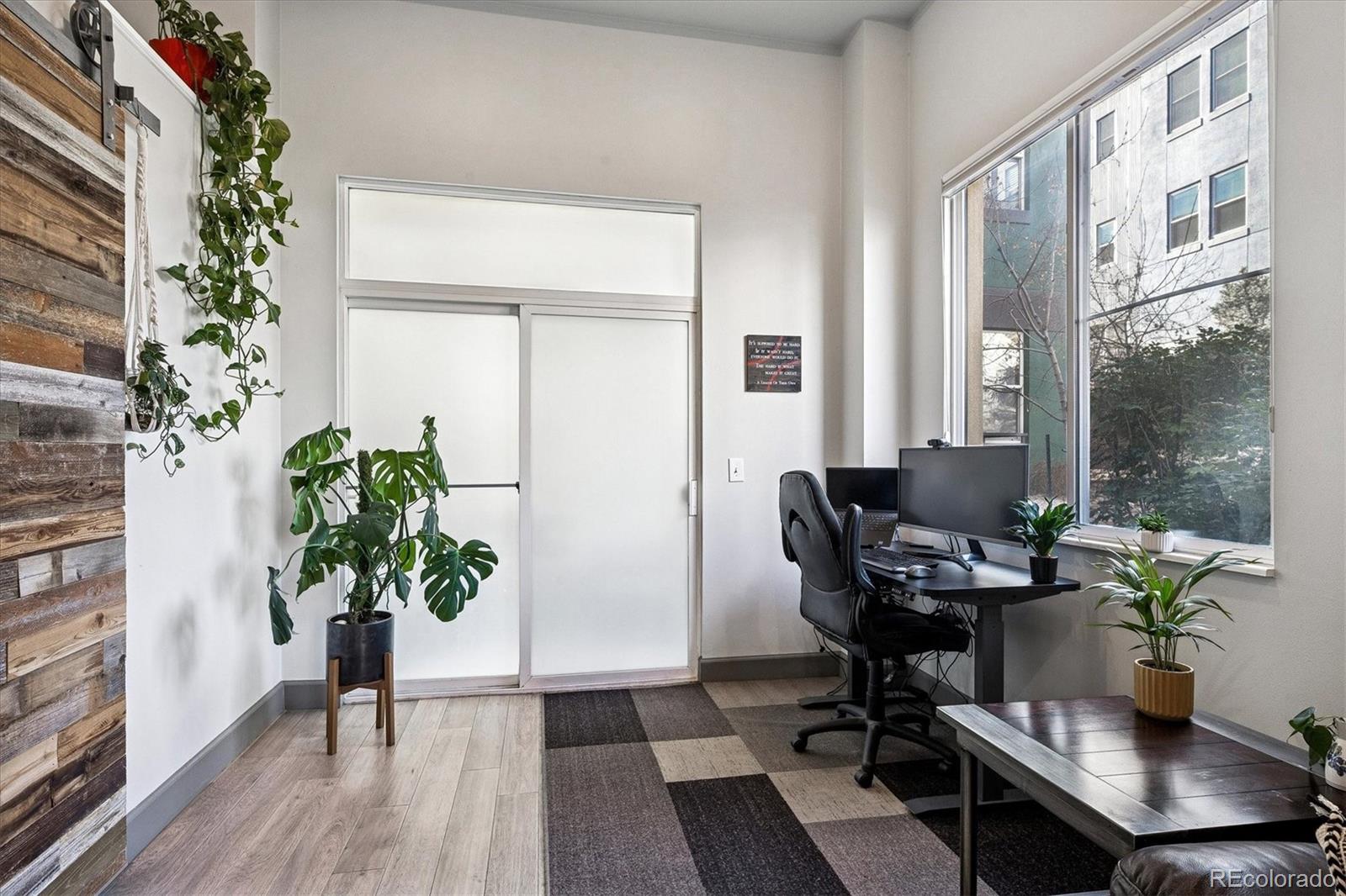 1521 Central Street, Unit 1D Denver, CO 80211 - Photo 12 of 27 a living room filled with furniture and a potted plant