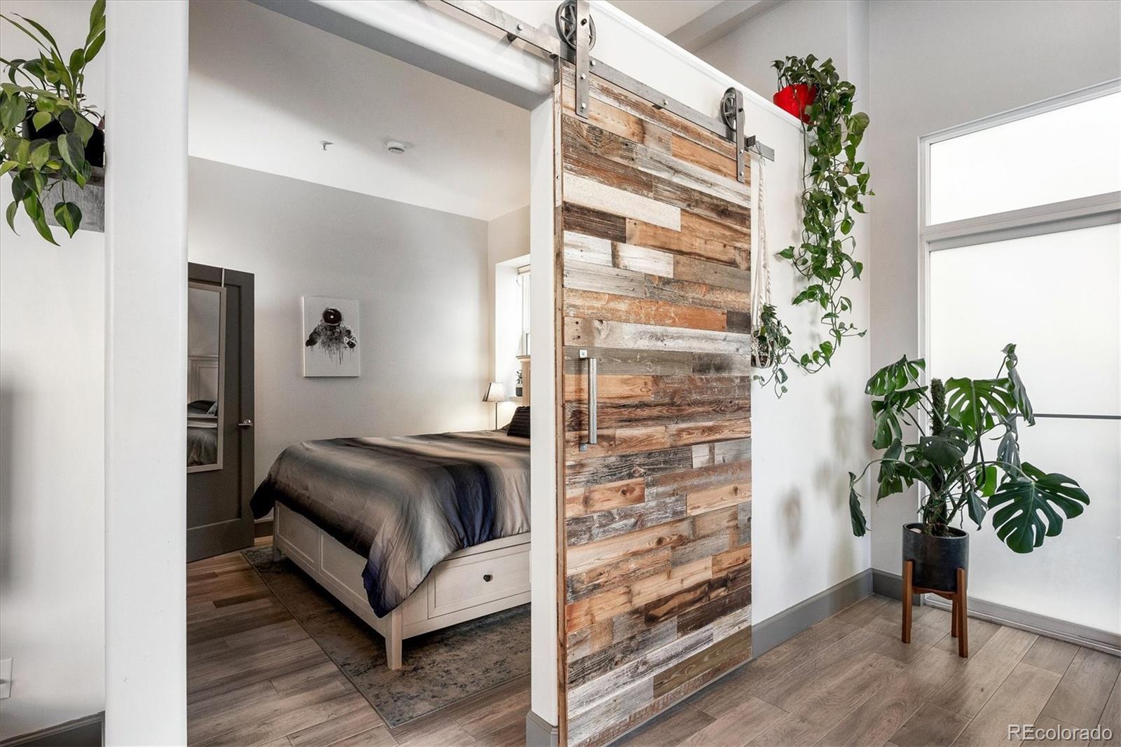 1521 Central Street, Unit 1D Denver, CO 80211 - Photo 13 of 27 a living room with furniture and a potted plant