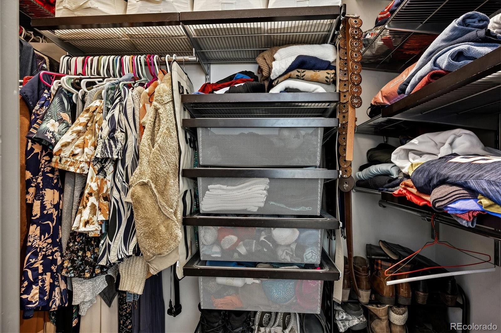 1521 Central Street, Unit 1D Denver, CO 80211 - Photo 16 of 27 a utility room with lots of different colored cloths