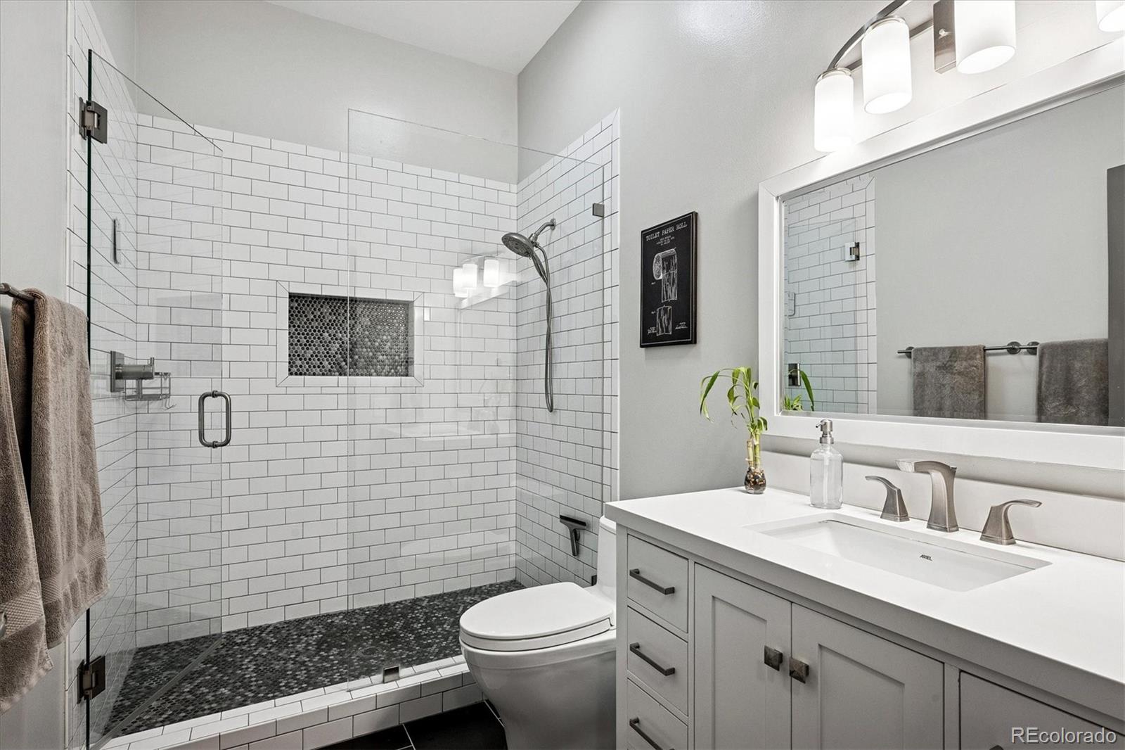 1521 Central Street, Unit 1D Denver, CO 80211 - Photo 17 of 27 a bathroom with a sink toilet and shower