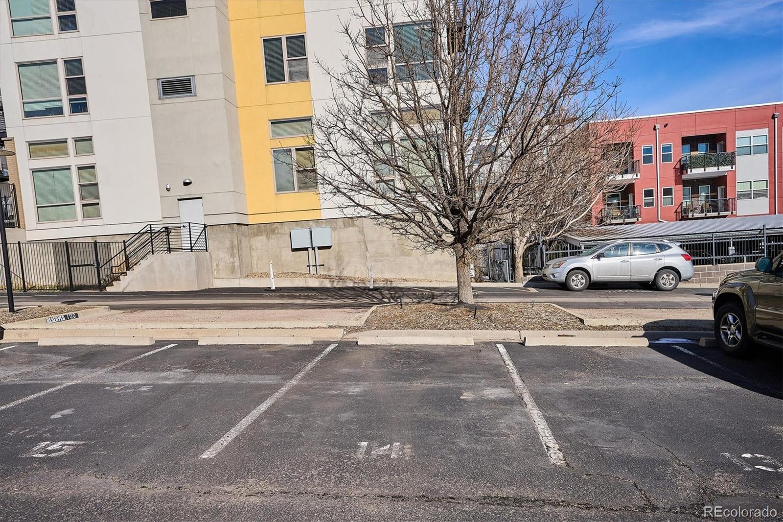 1521 Central Street, Unit 1D Denver, CO 80211 - Photo 20 of 27 a building with trees in front of it