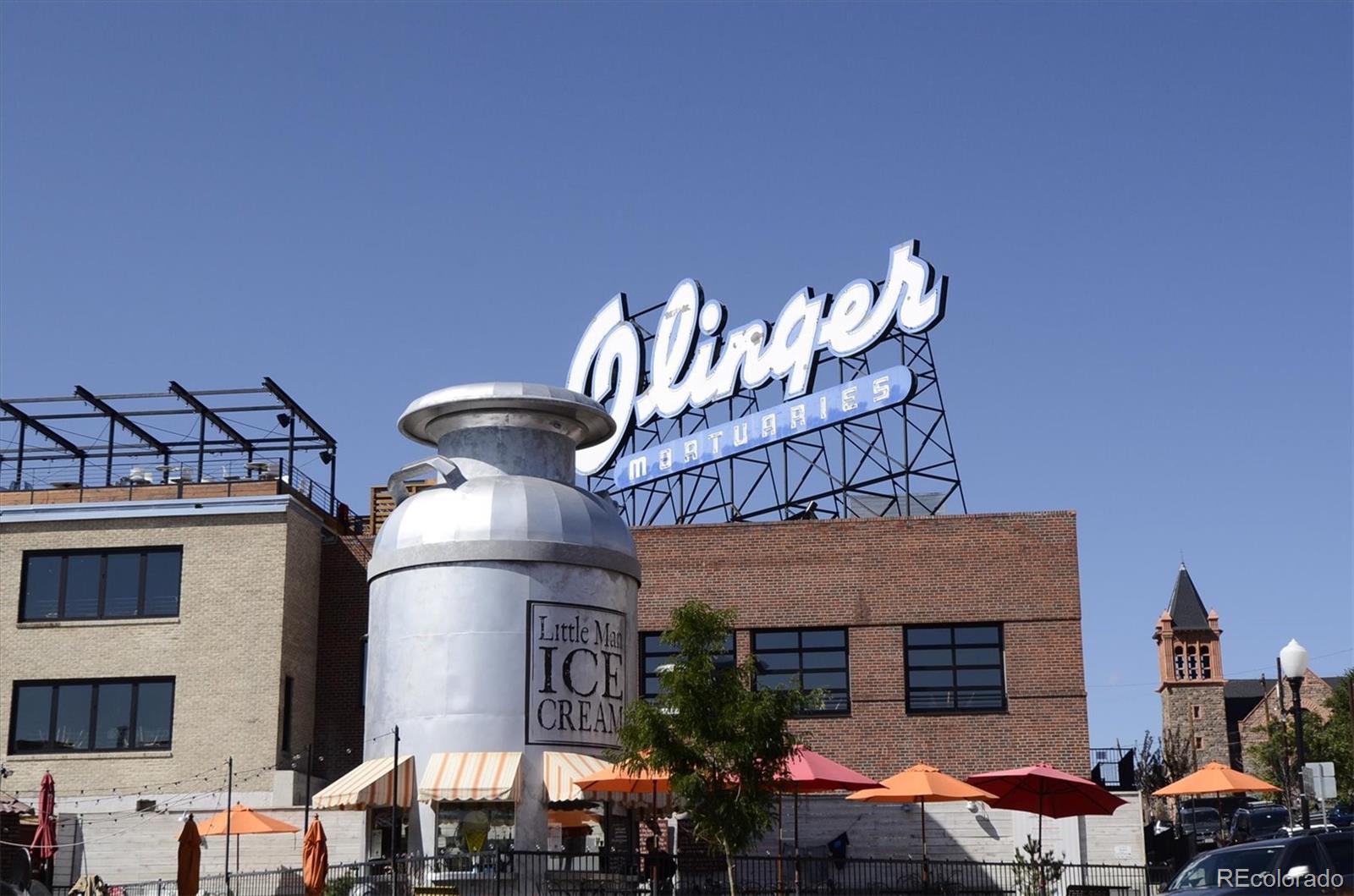 1521 Central Street, Unit 1D Denver, CO 80211 - Photo 24 of 27 a front view of a house with large trees
