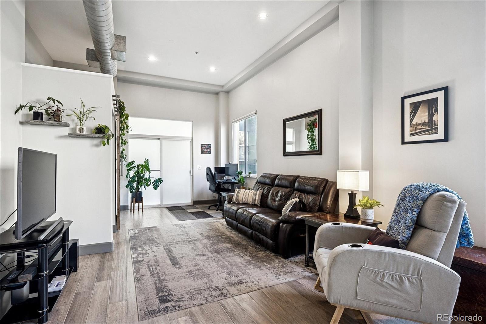1521 Central Street, Unit 1D Denver, CO 80211 - Photo 10 of 27 a living room with furniture
