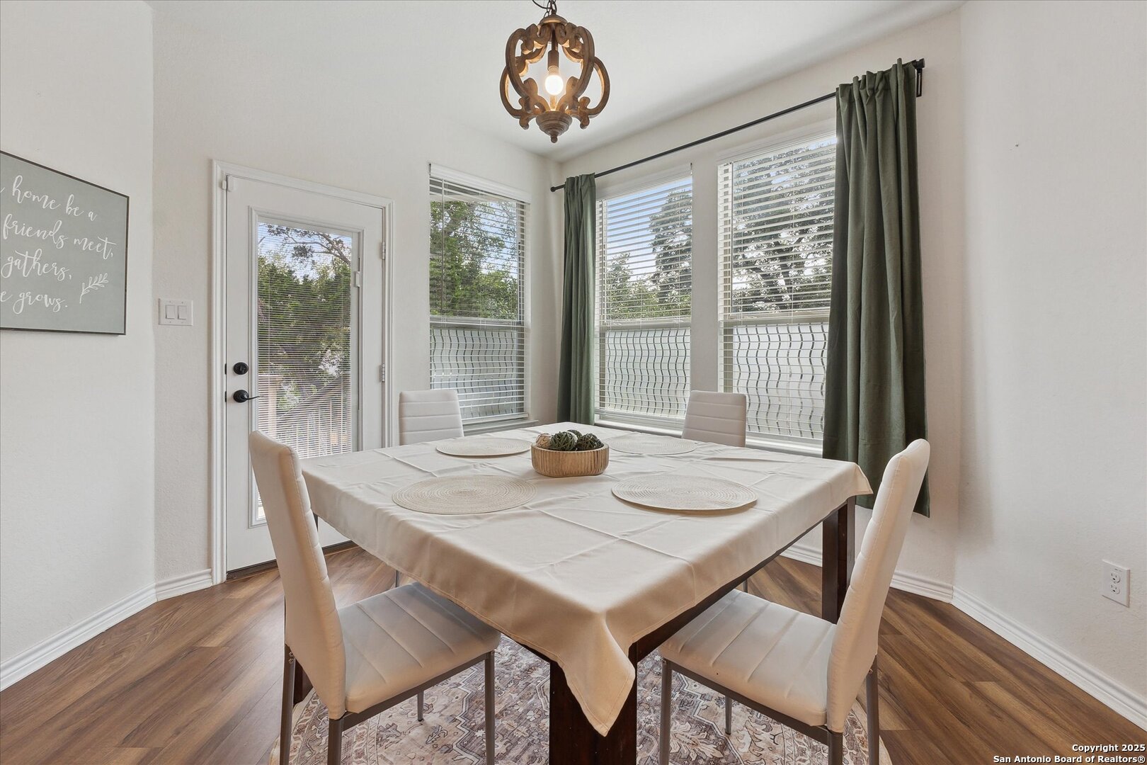 11314 Hill Top Bend Helotes, TX 78023 - Photo 14 of 49 a view of a dining room with furniture window and outside view