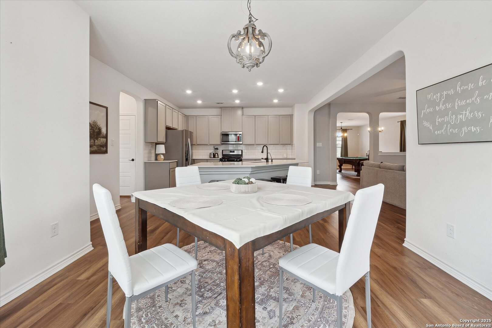 11314 Hill Top Bend Helotes, TX 78023 - Photo 15 of 49 a view of a dining room with furniture