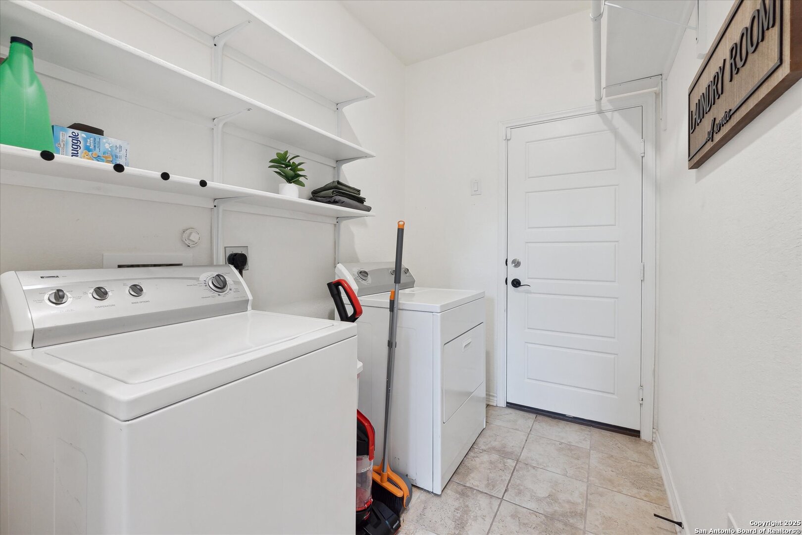 11314 Hill Top Bend Helotes, TX 78023 - Photo 17 of 49 a utility room with dryer and washer