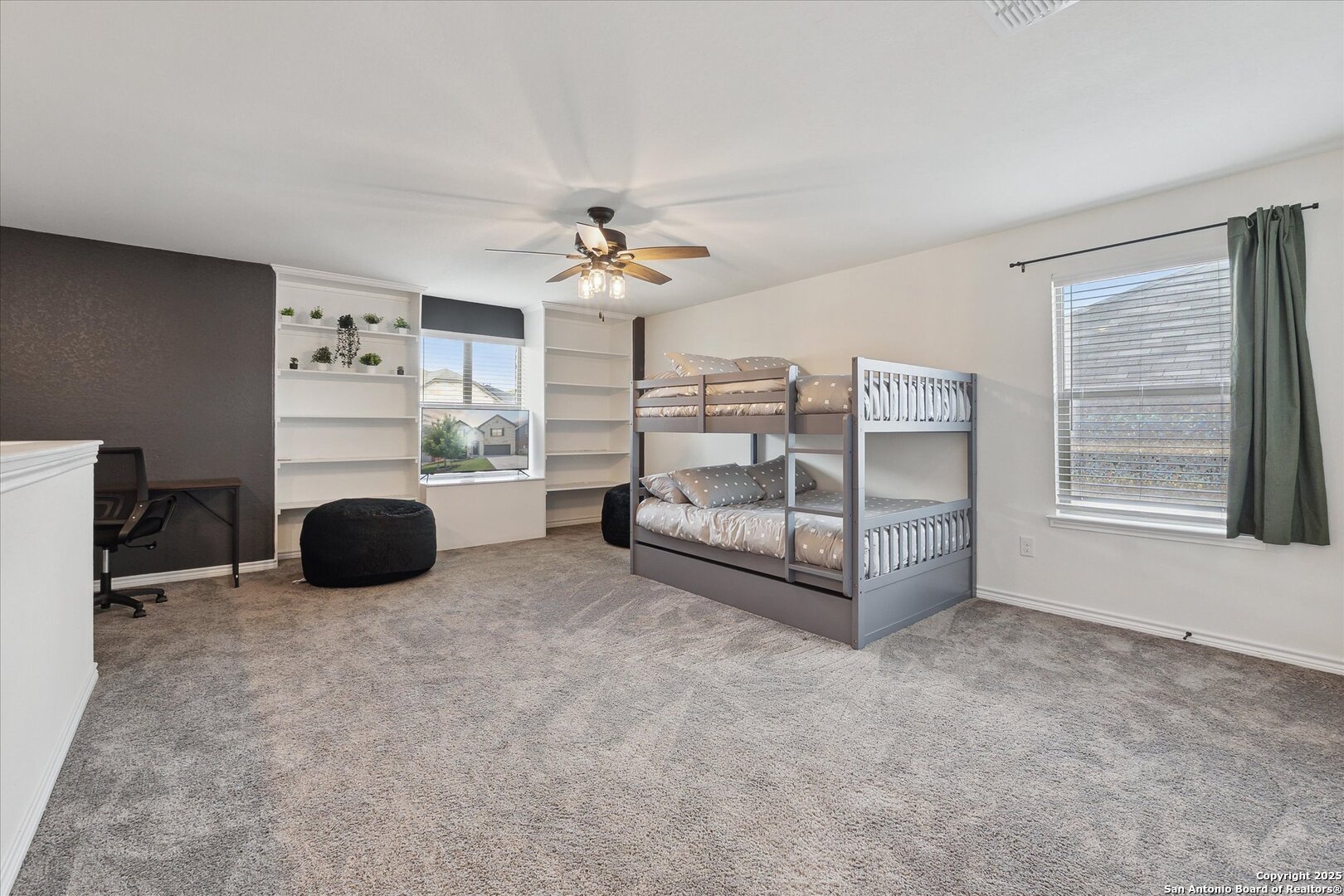 11314 Hill Top Bend Helotes, TX 78023 - Photo 24 of 49 a living room with furniture and a fireplace