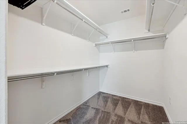 a view of an empty walk in closet