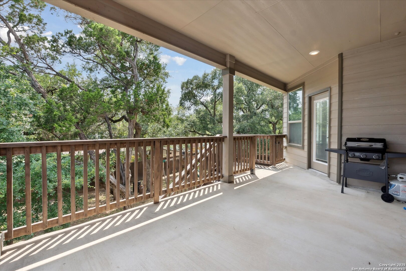 11314 Hill Top Bend Helotes, TX 78023 - Photo 44 of 49 a view of a balcony with chairs