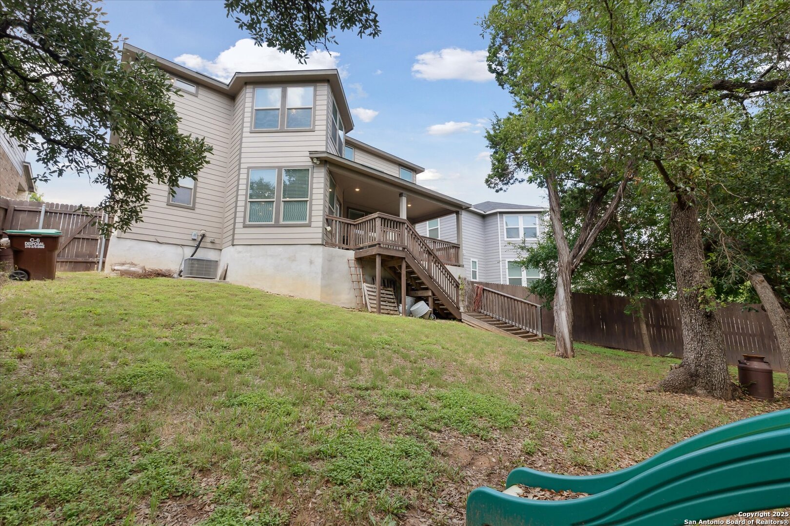 11314 Hill Top Bend Helotes, TX 78023 - Photo 49 of 49 front view of a house with a yard
