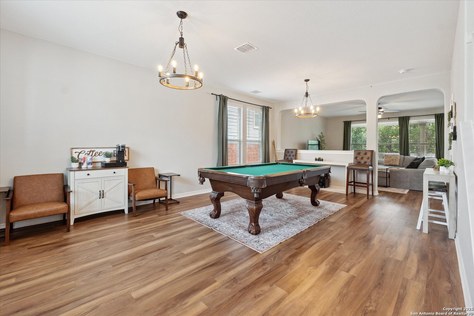 11314 Hill Top Bend Helotes, TX 78023 - Photo 7 of 49 a living room with furniture and wooden floor