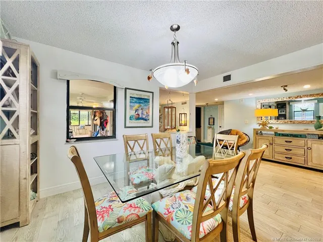 a living room with a flat screen tv and a fireplace