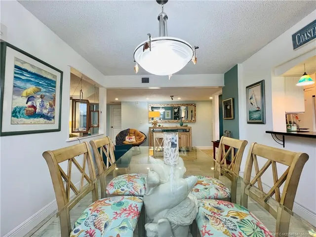 a bedroom with furniture and a large window