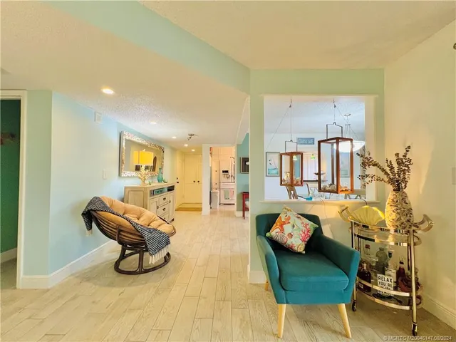 a view of a house with swimming pool and a yard