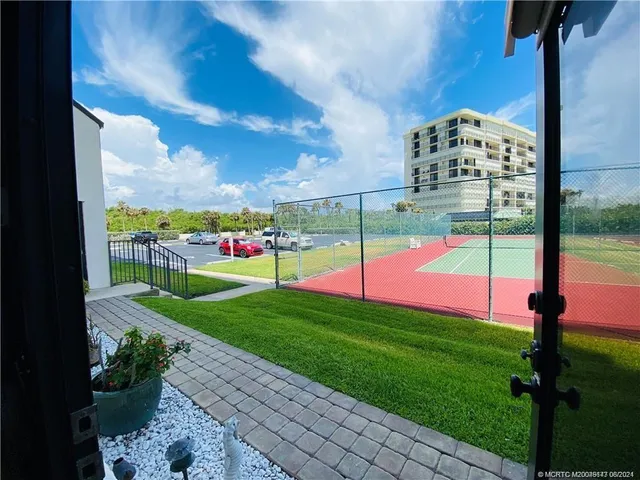 a bathroom with a sink a mirror and a shower