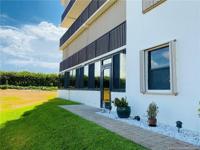 a bedroom with a bed window and couch