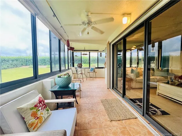 a view of swimming pool with seating area and barbeque oven