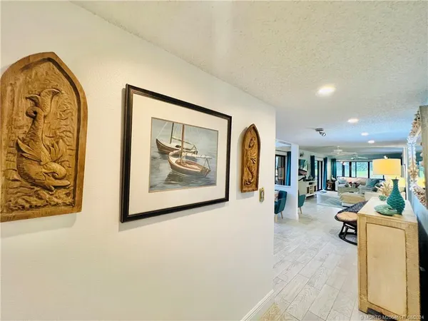 a kitchen with stainless steel appliances kitchen island wooden cabinets a stove and a refrigerator
